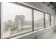 Large window with stunning city skyline views, offering a bright and open atmosphere at 120 Ralph Mcgill Ne Blvd # 1502, Atlanta, GA 30308