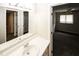 Bathroom vanity with a mirror and view into an adjacent bedroom at 1200 Ashborough Se Ter # A, Marietta, GA 30067