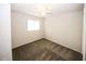 Bedroom with carpet flooring, a window and a ceiling fan with lighting at 1200 Ashborough Se Ter # A, Marietta, GA 30067