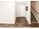 Bright foyer with wood-look floors, leading to staircase and interior doors at 1200 Ashborough Se Ter # A, Marietta, GA 30067