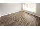 Inviting space featuring wood-look floors and a bright window for natural light at 1200 Ashborough Se Ter # A, Marietta, GA 30067