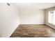 Spacious living area with wood-look floors, neutral paint, and a bright window at 1200 Ashborough Se Ter # A, Marietta, GA 30067