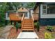 Lovely back deck with natural wood steps perfect for enjoying a relaxing afternoon outdoors at 243 Howell Ter, Atlanta, GA 30331