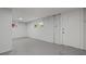 Unfinished basement space featuring bright walls, a concrete floor, and natural light from the windows at 243 Howell Ter, Atlanta, GA 30331