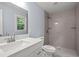 Bathroom with a white vanity, and a tiled shower at 243 Howell Ter, Atlanta, GA 30331