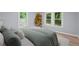 A bedroom with a plant next to a window at 243 Howell Ter, Atlanta, GA 30331