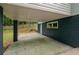 Covered carport offering protection for vehicles, with storage space in the back and access to the yard at 243 Howell Ter, Atlanta, GA 30331
