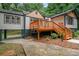 Beautiful home exterior with covered parking and wooden deck, ideal for relaxing outdoors at 243 Howell Ter, Atlanta, GA 30331