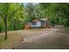 Single Gathering house featuring a front porch and a large yard, blending comfort with outdoor living at 243 Howell Ter, Atlanta, GA 30331