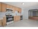 Kitchen featuring stainless steel appliances, ample counter space, and light-toned cabinets at 243 Howell Ter, Atlanta, GA 30331