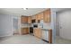 A kitchen with stainless steel appliances, and light wood cabinets at 243 Howell Ter, Atlanta, GA 30331