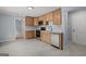 Spacious kitchen with stainless steel appliances and light cabinets, offering a seamless transition to other areas at 243 Howell Ter, Atlanta, GA 30331