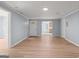 Spacious living room showcasing hardwood floors, fresh paint, and access to various areas of the home at 243 Howell Ter, Atlanta, GA 30331