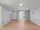 Spacious living room boasting light wood floors and an open doorway to the kitchen at 243 Howell Ter, Atlanta, GA 30331