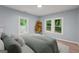 Serene main bedroom with natural light, showcasing hardwood floors and a calming color palette at 243 Howell Ter, Atlanta, GA 30331