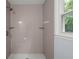 A gray tiled shower with two shelves at 243 Howell Ter, Atlanta, GA 30331