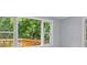A bright room with a window view to an outdoor deck at 243 Howell Ter, Atlanta, GA 30331