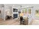 Bright living room with a fireplace and large windows, creating an inviting space for relaxation and entertainment at 3443 Hillyard Dr, Dacula, GA 30019