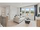 Upstairs loft with large windows, a couch, and a relaxing sitting area at 3443 Hillyard Dr, Dacula, GA 30019