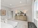 Elegant main bedroom with stylish decor and tray ceiling at 3443 Hillyard Dr, Dacula, GA 30019
