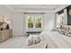 Bright main bedroom featuring tray ceilings and stylish decor at 3443 Hillyard Dr, Dacula, GA 30019