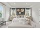 Comfortable main bedroom offering natural light, modern design, and chic furnishings at 3443 Hillyard Dr, Dacula, GA 30019
