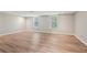 Spacious basement area with modern vinyl flooring, neutral paint, and bright, natural light at 4005 Greentree Ct, Douglasville, GA 30135