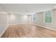 Finished basement showcasing bright windows and modern flooring, perfect for a variety of uses at 4005 Greentree Ct, Douglasville, GA 30135