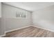 Cozy basement room featuring wood-look floors, a window for natural light, and a clean, modern aesthetic at 4005 Greentree Ct, Douglasville, GA 30135