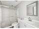 Updated bathroom with a modern vanity, toilet, and glass-enclosed shower, offering a clean and stylish design at 4005 Greentree Ct, Douglasville, GA 30135