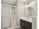Well lit bathroom featuring shower, vanity and decorative mirror at 4005 Greentree Ct, Douglasville, GA 30135