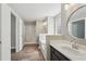 This updated bathroom features modern fixtures, a walk-in shower, and wood-look flooring at 4005 Greentree Ct, Douglasville, GA 30135