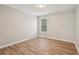 This bedroom has a big window with great natural light and warm, wood-look flooring at 4005 Greentree Ct, Douglasville, GA 30135