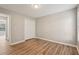 This bedroom features wood-look floors, a big window, and a closet for storage at 4005 Greentree Ct, Douglasville, GA 30135