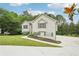 Charming home with neutral siding, dark shutters, and a well-manicured lawn, showcasing curb appeal at 4005 Greentree Ct, Douglasville, GA 30135