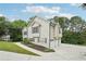 View of the home featuring a three-car garage and well-maintained landscaping at 4005 Greentree Ct, Douglasville, GA 30135
