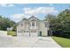 Exterior view of home with three car garage and second story entrance at 4005 Greentree Ct, Douglasville, GA 30135