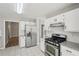 Well-lit kitchen featuring stainless steel appliances and granite counters at 4005 Greentree Ct, Douglasville, GA 30135