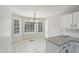 Eat-in kitchen featuring ample windows and a modern chandelier at 4005 Greentree Ct, Douglasville, GA 30135