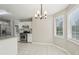 Eat-in kitchen featuring stainless steel appliances, granite counters, and a modern chandelier at 4005 Greentree Ct, Douglasville, GA 30135