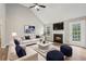 Living room featuring vaulted ceilings, wood floors, fireplace, and backyard access at 4005 Greentree Ct, Douglasville, GA 30135