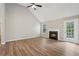 Bright living room with vaulted ceilings, wood floors, and a cozy fireplace at 4005 Greentree Ct, Douglasville, GA 30135