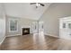 Bright living room with vaulted ceilings, wood floors, and a cozy fireplace at 4005 Greentree Ct, Douglasville, GA 30135