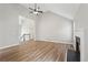 Open living room with trey ceilings, wood floors, and fireplace at 4005 Greentree Ct, Douglasville, GA 30135