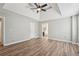 Spacious main bedroom with hardwood floors and views into the ensuite bathroom at 4005 Greentree Ct, Douglasville, GA 30135
