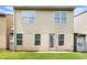 Back exterior of home showing vinyl siding and large double-paned windows at 222 Ben Ln, Fairburn, GA 30213