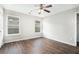 Spacious bedroom with hardwood flooring, ceiling fan, and neutral paint at 222 Ben Ln, Fairburn, GA 30213
