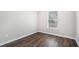 Bright bedroom featuring neutral paint, hardwood flooring, and ample light at 222 Ben Ln, Fairburn, GA 30213