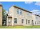 Rear exterior with vinyl siding, lawn, and satellite dish at 222 Ben Ln, Fairburn, GA 30213