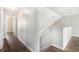 Hallway and stairs features modern paint and hardwood flooring at 222 Ben Ln, Fairburn, GA 30213
